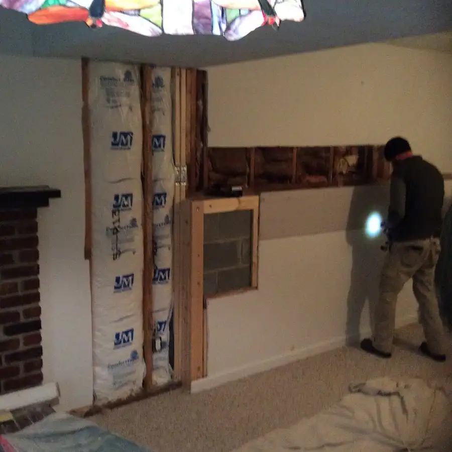 Restoration technician inspecting water damage in Waipio